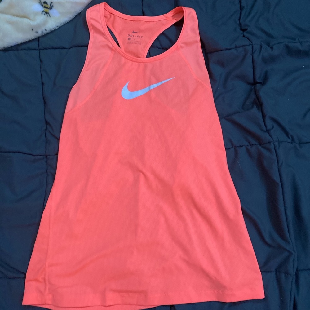 Medium Women’s orange Nike tank.